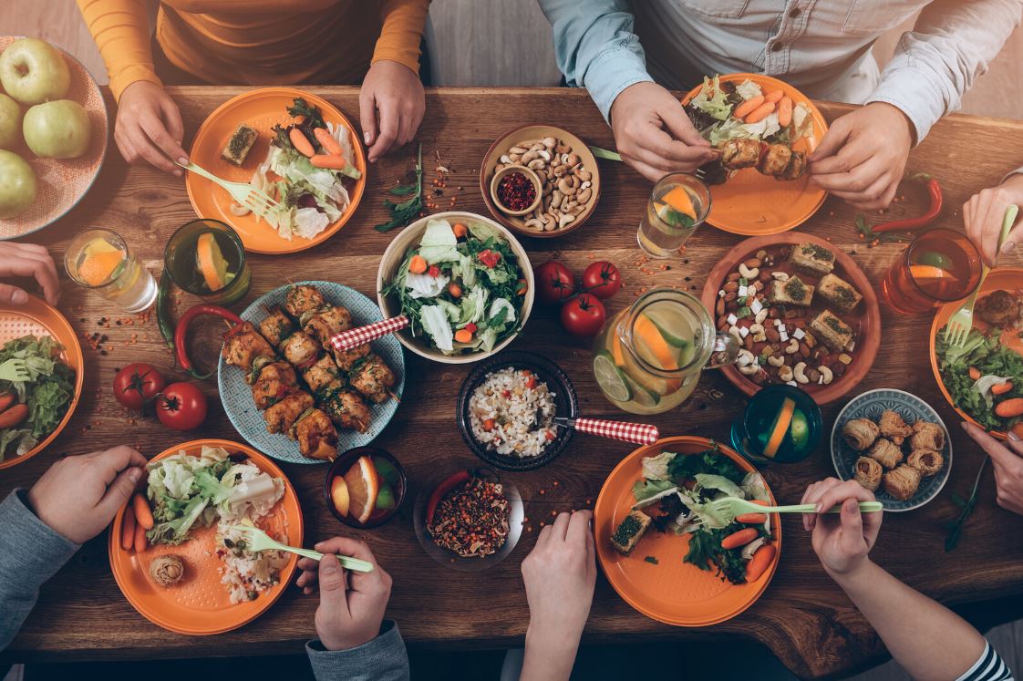 Sharing Food At Dinner Table